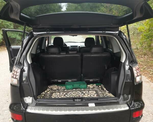 Чорний Міцубісі Аутлендер, об'ємом двигуна 2 л та пробігом 220 тис. км за 10700 $, фото 9 на Automoto.ua