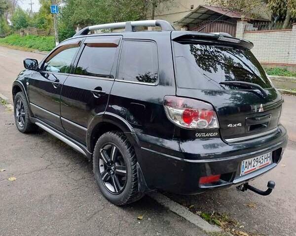 Черный Мицубиси Аутлендер, объемом двигателя 2 л и пробегом 223 тыс. км за 7200 $, фото 6 на Automoto.ua