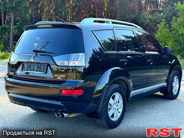 Чорний Міцубісі Аутлендер, об'ємом двигуна 2.4 л та пробігом 171 тис. км за 8999 $, фото 6 на Automoto.ua