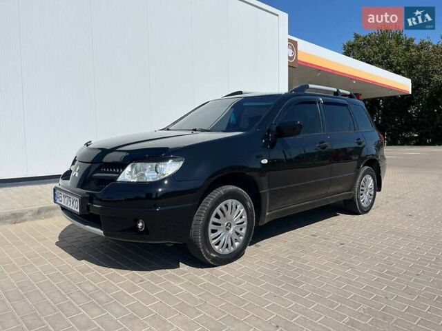 Черный Мицубиси Аутлендер, объемом двигателя 2 л и пробегом 236 тыс. км за 6699 $, фото 9 на Automoto.ua