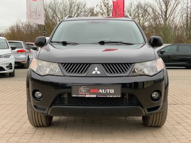 Черный Мицубиси Аутлендер, объемом двигателя 2.4 л и пробегом 175 тыс. км за 10499 $, фото 1 на Automoto.ua