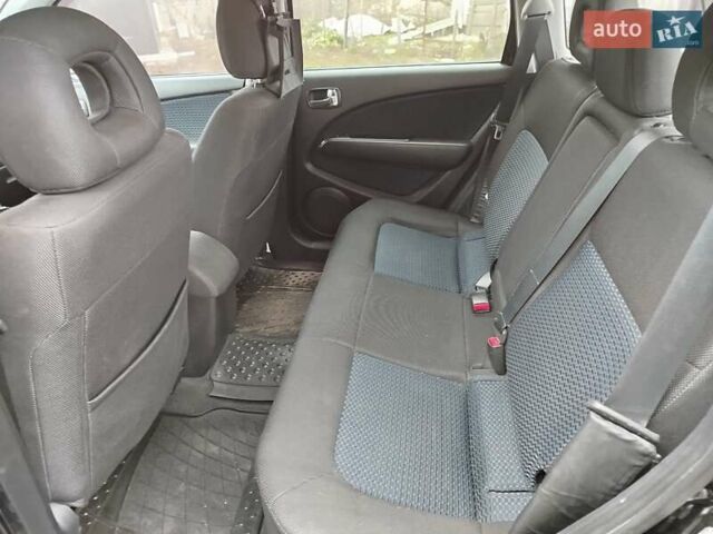 Чорний Міцубісі Аутлендер, об'ємом двигуна 2.38 л та пробігом 149 тис. км за 8800 $, фото 11 на Automoto.ua