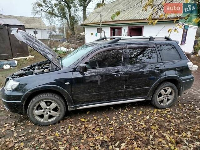 Чорний Міцубісі Аутлендер, об'ємом двигуна 2.38 л та пробігом 149 тис. км за 8800 $, фото 1 на Automoto.ua