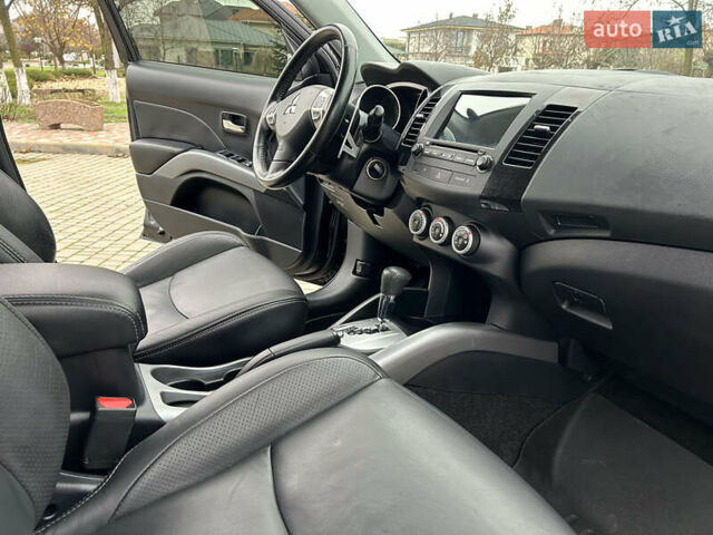 Черный Мицубиси Аутлендер, объемом двигателя 3 л и пробегом 77 тыс. км за 11800 $, фото 22 на Automoto.ua