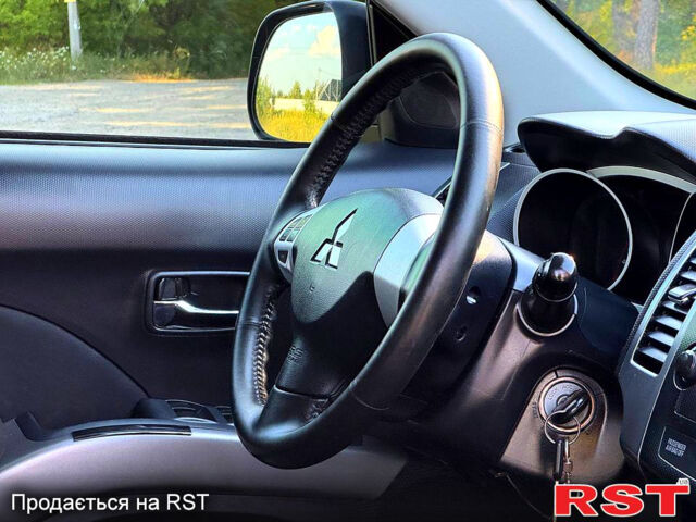 Чорний Міцубісі Аутлендер, об'ємом двигуна 2.4 л та пробігом 171 тис. км за 8999 $, фото 10 на Automoto.ua