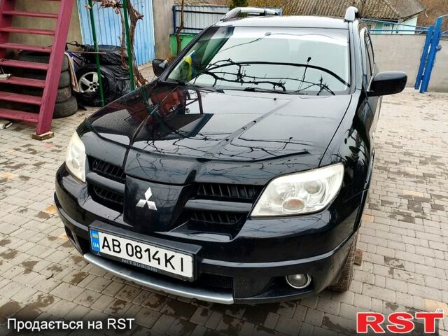 Черный Мицубиси Аутлендер, объемом двигателя 2 л и пробегом 280 тыс. км за 5800 $, фото 1 на Automoto.ua