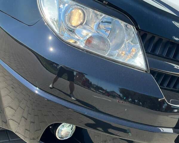 Черный Мицубиси Аутлендер, объемом двигателя 2 л и пробегом 236 тыс. км за 6699 $, фото 4 на Automoto.ua