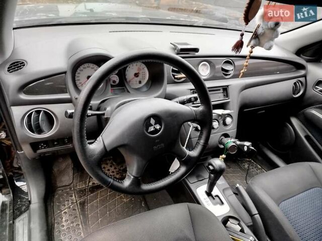 Чорний Міцубісі Аутлендер, об'ємом двигуна 2.38 л та пробігом 149 тис. км за 8800 $, фото 8 на Automoto.ua