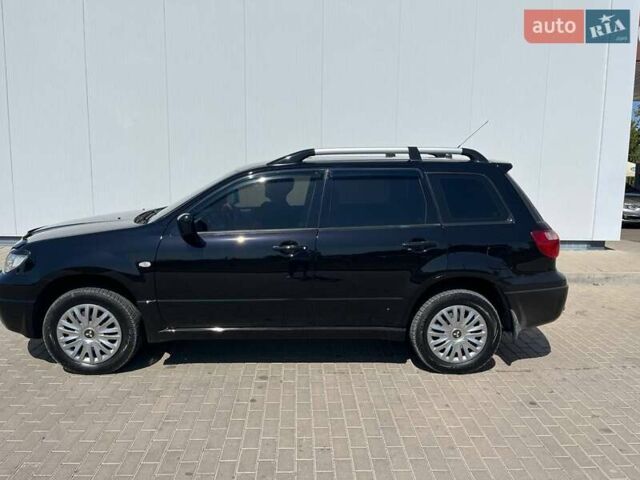 Черный Мицубиси Аутлендер, объемом двигателя 2 л и пробегом 236 тыс. км за 6699 $, фото 10 на Automoto.ua