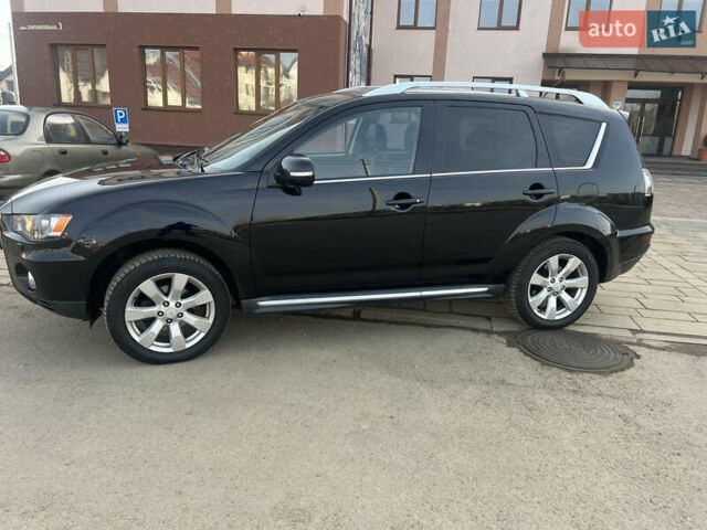 Черный Мицубиси Аутлендер, объемом двигателя 2.36 л и пробегом 244 тыс. км за 9850 $, фото 4 на Automoto.ua