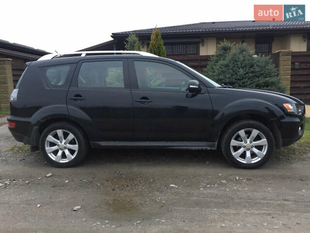 Черный Мицубиси Аутлендер, объемом двигателя 2.36 л и пробегом 315 тыс. км за 9700 $, фото 5 на Automoto.ua