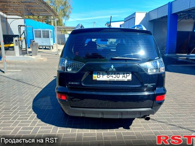 Чорний Міцубісі Аутлендер, об'ємом двигуна 2 л та пробігом 291 тис. км за 11200 $, фото 2 на Automoto.ua