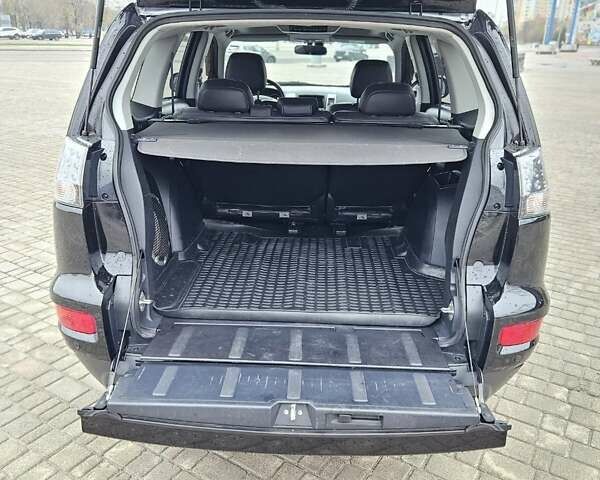 Чорний Міцубісі Аутлендер, об'ємом двигуна 2.4 л та пробігом 70 тис. км за 13000 $, фото 17 на Automoto.ua