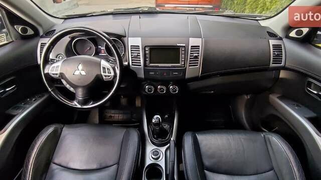 Черный Мицубиси Аутлендер, объемом двигателя 2 л и пробегом 210 тыс. км за 10600 $, фото 18 на Automoto.ua