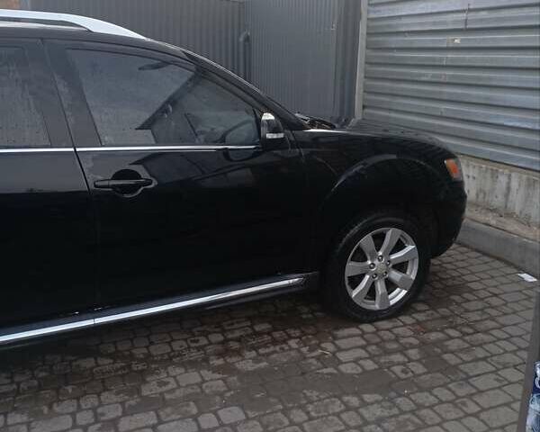 Черный Мицубиси Аутлендер, объемом двигателя 2.2 л и пробегом 264 тыс. км за 10700 $, фото 4 на Automoto.ua