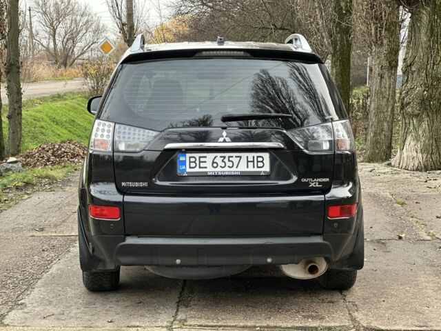 Черный Мицубиси Аутлендер, объемом двигателя 2.4 л и пробегом 197 тыс. км за 11300 $, фото 5 на Automoto.ua