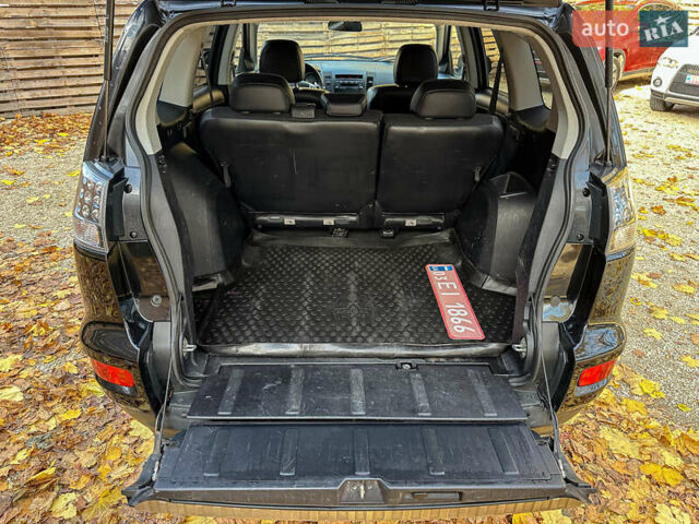 Черный Мицубиси Аутлендер, объемом двигателя 2.2 л и пробегом 226 тыс. км за 11500 $, фото 91 на Automoto.ua