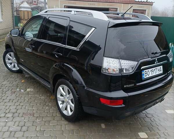 Черный Мицубиси Аутлендер, объемом двигателя 2.2 л и пробегом 225 тыс. км за 11500 $, фото 4 на Automoto.ua