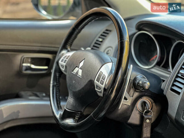 Черный Мицубиси Аутлендер, объемом двигателя 2.2 л и пробегом 226 тыс. км за 11500 $, фото 101 на Automoto.ua