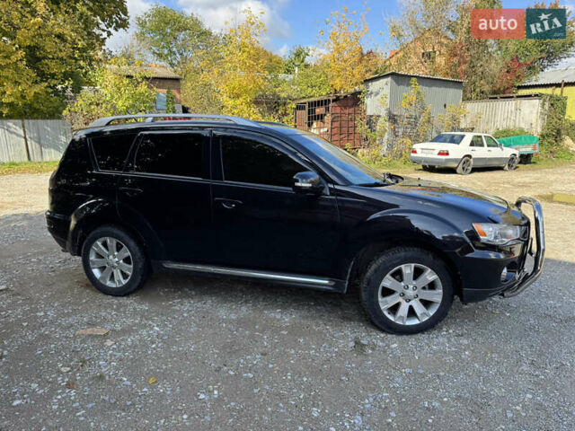 Чорний Міцубісі Аутлендер, об'ємом двигуна 2 л та пробігом 258 тис. км за 8699 $, фото 4 на Automoto.ua