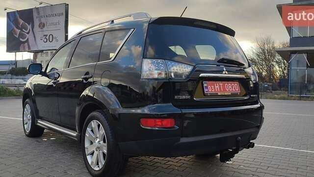 Черный Мицубиси Аутлендер, объемом двигателя 2 л и пробегом 210 тыс. км за 10600 $, фото 5 на Automoto.ua