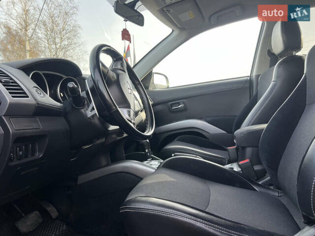 Черный Мицубиси Аутлендер, объемом двигателя 2.36 л и пробегом 244 тыс. км за 9850 $, фото 18 на Automoto.ua