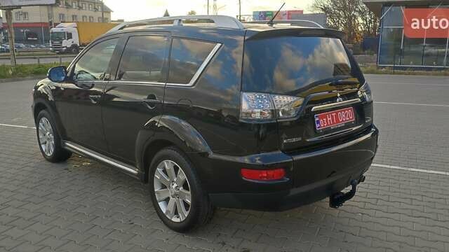 Черный Мицубиси Аутлендер, объемом двигателя 2 л и пробегом 210 тыс. км за 10600 $, фото 4 на Automoto.ua