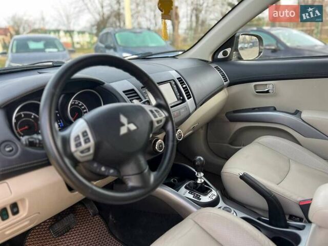 Черный Мицубиси Аутлендер, объемом двигателя 2.18 л и пробегом 249 тыс. км за 11500 $, фото 21 на Automoto.ua