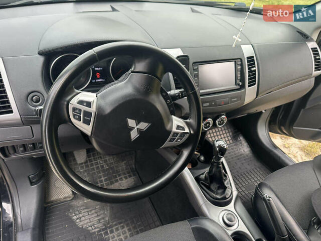 Черный Мицубиси Аутлендер, объемом двигателя 1.97 л и пробегом 224 тыс. км за 9000 $, фото 1 на Automoto.ua