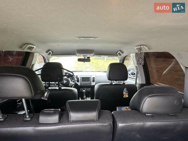 Черный Мицубиси Аутлендер, объемом двигателя 1.97 л и пробегом 224 тыс. км за 9000 $, фото 8 на Automoto.ua