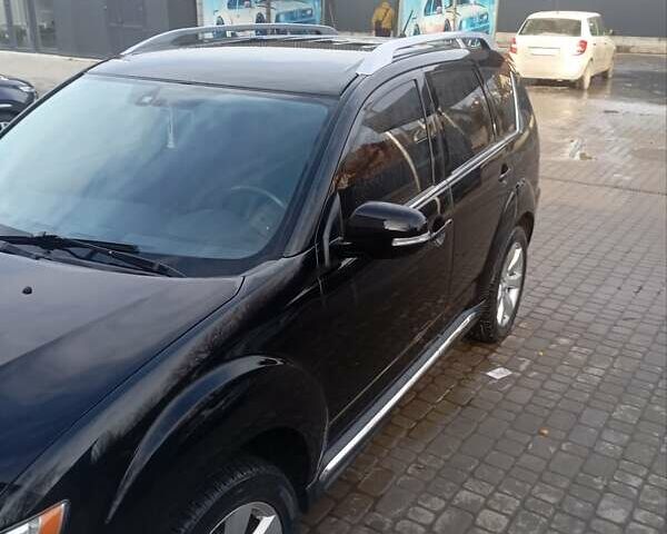 Черный Мицубиси Аутлендер, объемом двигателя 2.2 л и пробегом 264 тыс. км за 10700 $, фото 1 на Automoto.ua