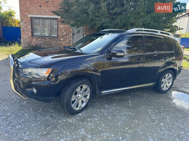 Чорний Міцубісі Аутлендер, об'ємом двигуна 2 л та пробігом 258 тис. км за 8699 $, фото 8 на Automoto.ua