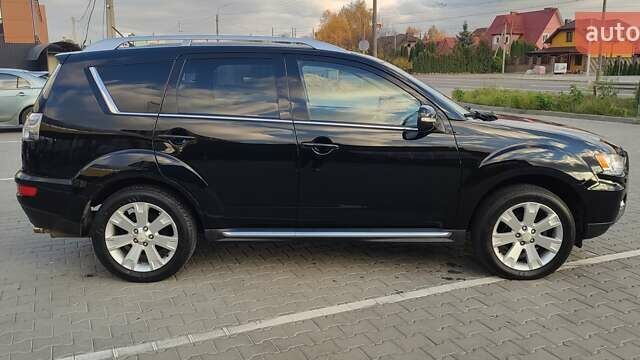 Черный Мицубиси Аутлендер, объемом двигателя 2 л и пробегом 210 тыс. км за 10600 $, фото 8 на Automoto.ua