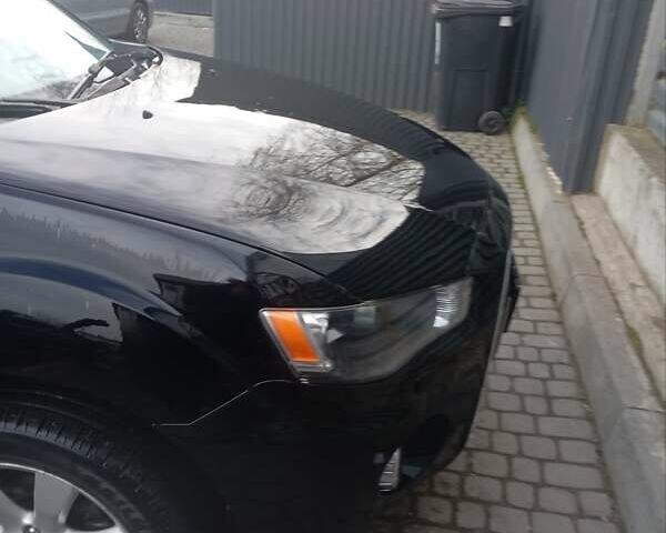 Черный Мицубиси Аутлендер, объемом двигателя 2.2 л и пробегом 264 тыс. км за 10700 $, фото 2 на Automoto.ua