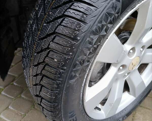 Черный Мицубиси Аутлендер, объемом двигателя 2.2 л и пробегом 225 тыс. км за 11500 $, фото 5 на Automoto.ua