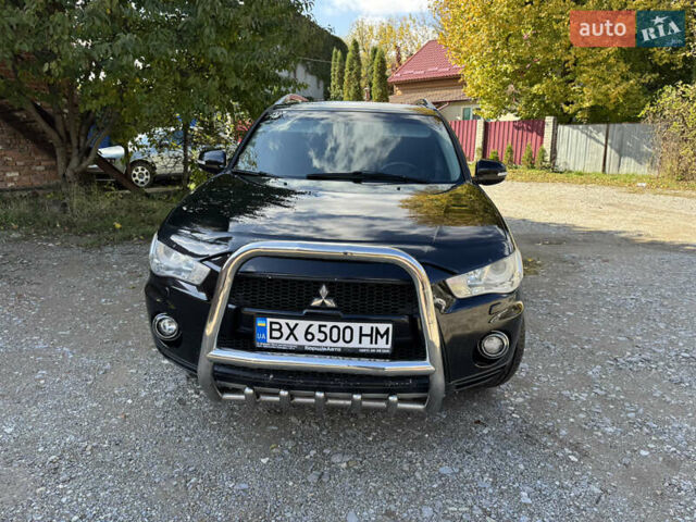 Чорний Міцубісі Аутлендер, об'ємом двигуна 2 л та пробігом 258 тис. км за 8699 $, фото 1 на Automoto.ua
