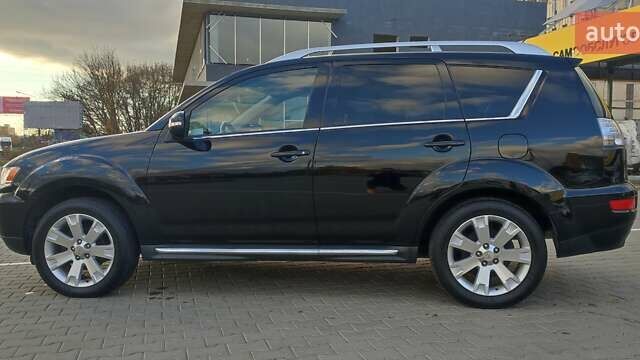Черный Мицубиси Аутлендер, объемом двигателя 2 л и пробегом 210 тыс. км за 10600 $, фото 3 на Automoto.ua