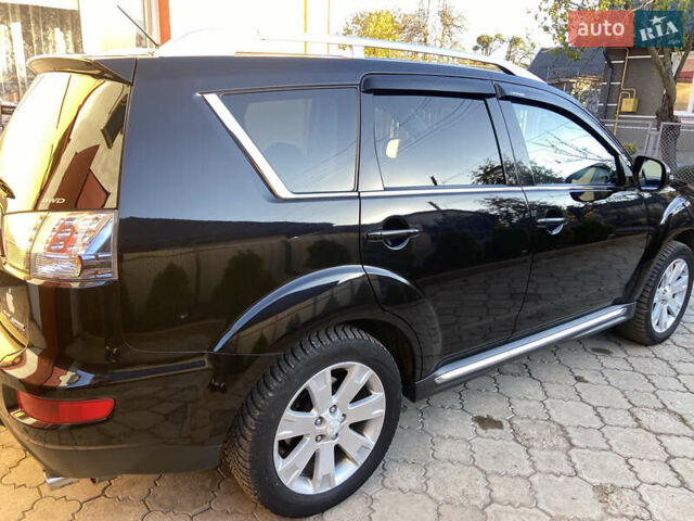 Черный Мицубиси Аутлендер, объемом двигателя 1.97 л и пробегом 292 тыс. км за 10900 $, фото 4 на Automoto.ua