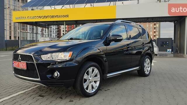Черный Мицубиси Аутлендер, объемом двигателя 2 л и пробегом 210 тыс. км за 10600 $, фото 2 на Automoto.ua