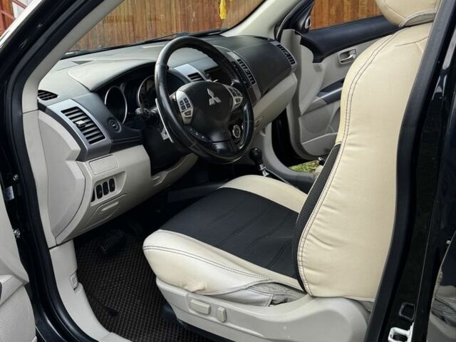 Черный Мицубиси Аутлендер, объемом двигателя 2.2 л и пробегом 249 тыс. км за 11500 $, фото 1 на Automoto.ua