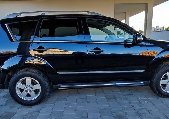 Черный Мицубиси Аутлендер, объемом двигателя 2 л и пробегом 264 тыс. км за 2900 $, фото 5 на Automoto.ua
