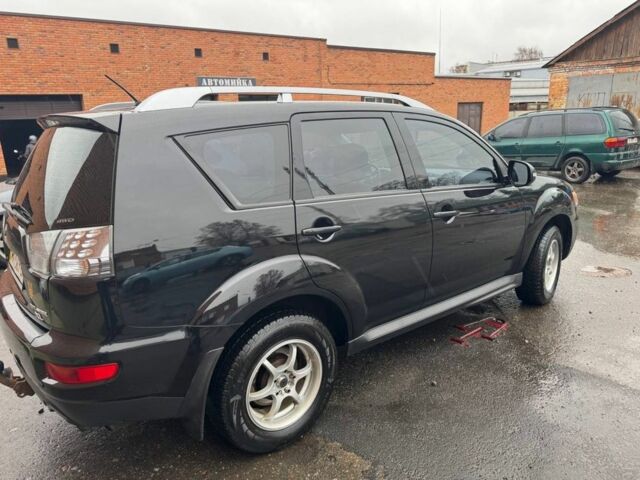 Черный Мицубиси Аутлендер, объемом двигателя 2.4 л и пробегом 305 тыс. км за 10000 $, фото 3 на Automoto.ua