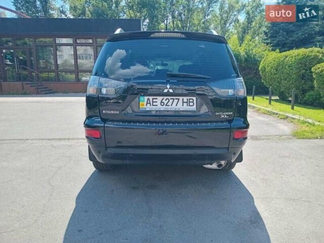 Черный Мицубиси Аутлендер, объемом двигателя 2 л и пробегом 165 тыс. км за 11300 $, фото 1 на Automoto.ua