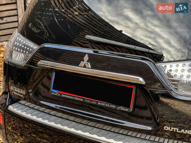 Черный Мицубиси Аутлендер, объемом двигателя 2.2 л и пробегом 226 тыс. км за 11500 $, фото 51 на Automoto.ua