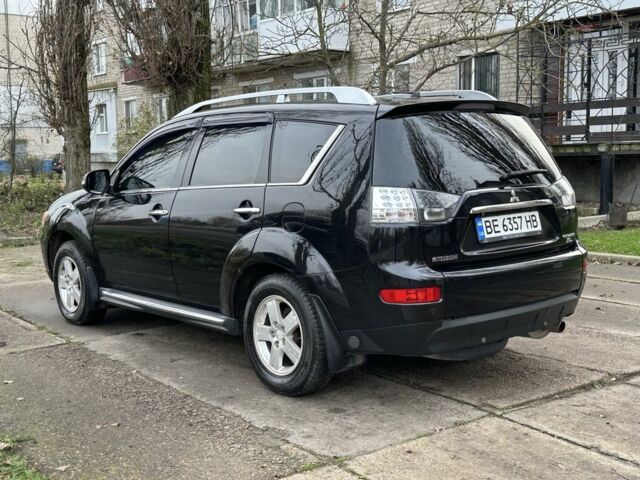 Черный Мицубиси Аутлендер, объемом двигателя 2.4 л и пробегом 197 тыс. км за 11300 $, фото 3 на Automoto.ua