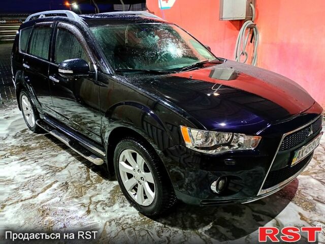 Черный Мицубиси Аутлендер, объемом двигателя 2.4 л и пробегом 70 тыс. км за 10500 $, фото 2 на Automoto.ua