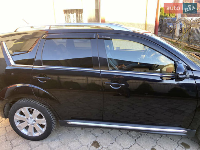 Черный Мицубиси Аутлендер, объемом двигателя 1.97 л и пробегом 292 тыс. км за 10900 $, фото 5 на Automoto.ua