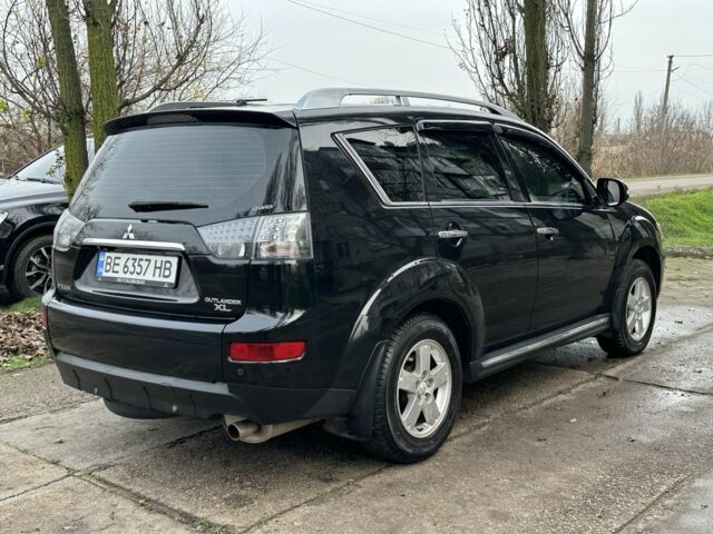 Черный Мицубиси Аутлендер, объемом двигателя 2.4 л и пробегом 197 тыс. км за 11300 $, фото 2 на Automoto.ua