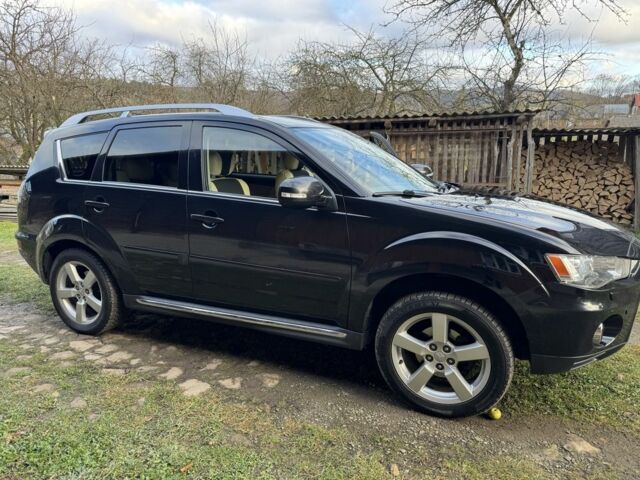 Черный Мицубиси Аутлендер, объемом двигателя 2.2 л и пробегом 249 тыс. км за 11500 $, фото 6 на Automoto.ua