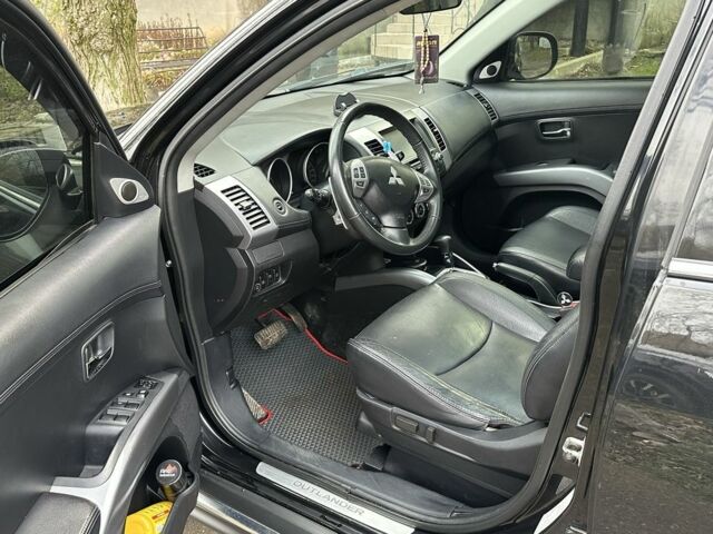 Черный Мицубиси Аутлендер, объемом двигателя 2.4 л и пробегом 197 тыс. км за 11300 $, фото 6 на Automoto.ua